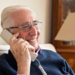Smiling man on a phone